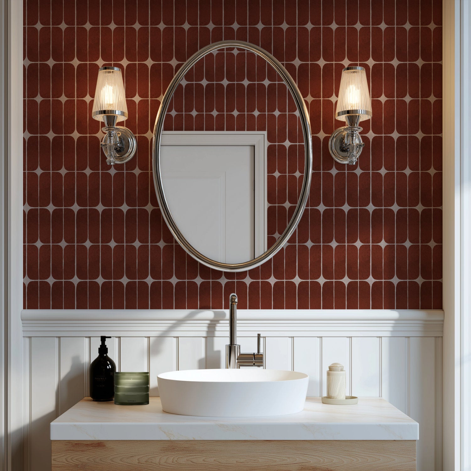 Terracotta retro tile wallpaper in a powder room behind an oval mirror and wall lights
