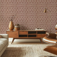 Terracotta geometric wallpaper with flower of life pattern in a mid-century style living room