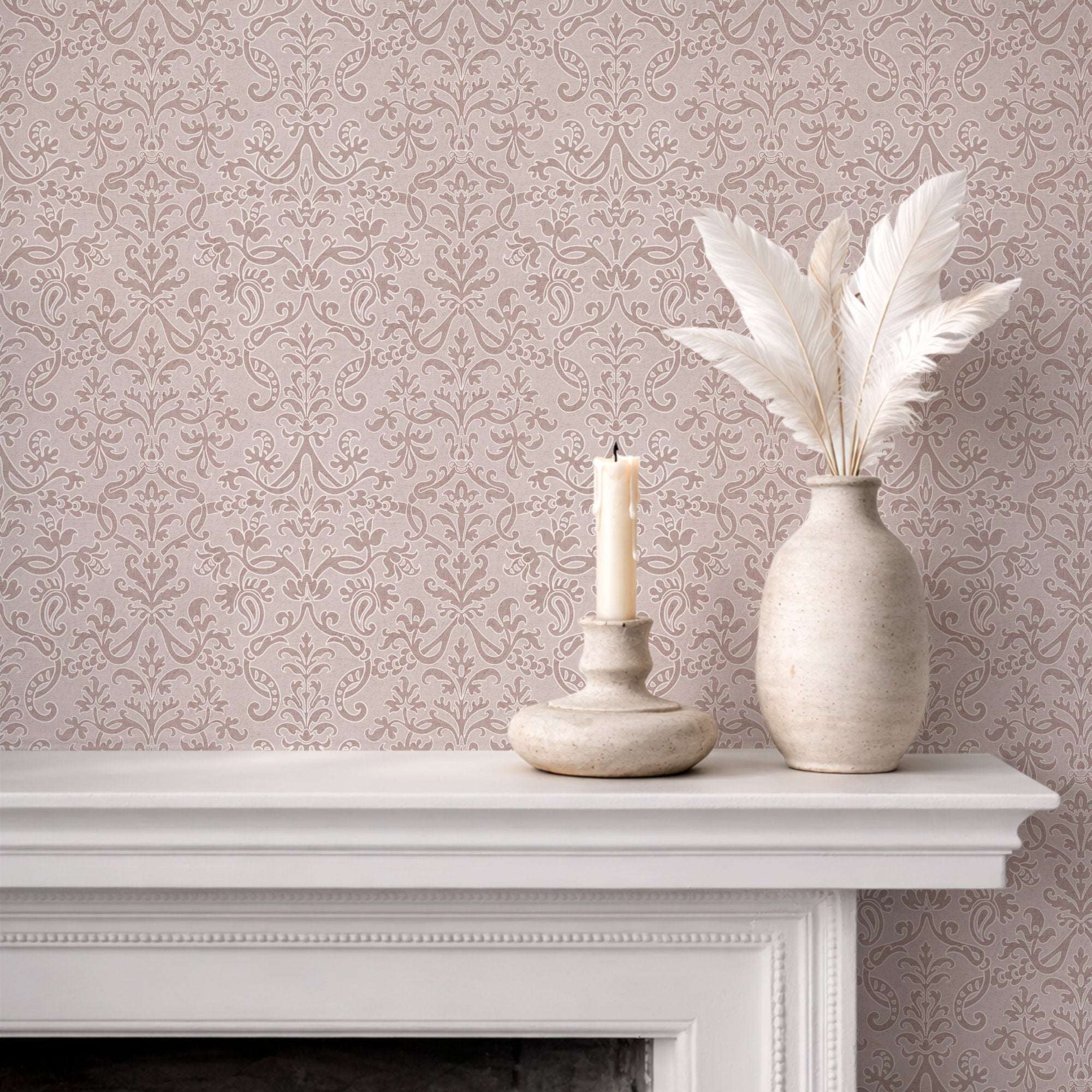 Floral damask wallpaper in soft pink with repeating ornate scroll and leaf pattern