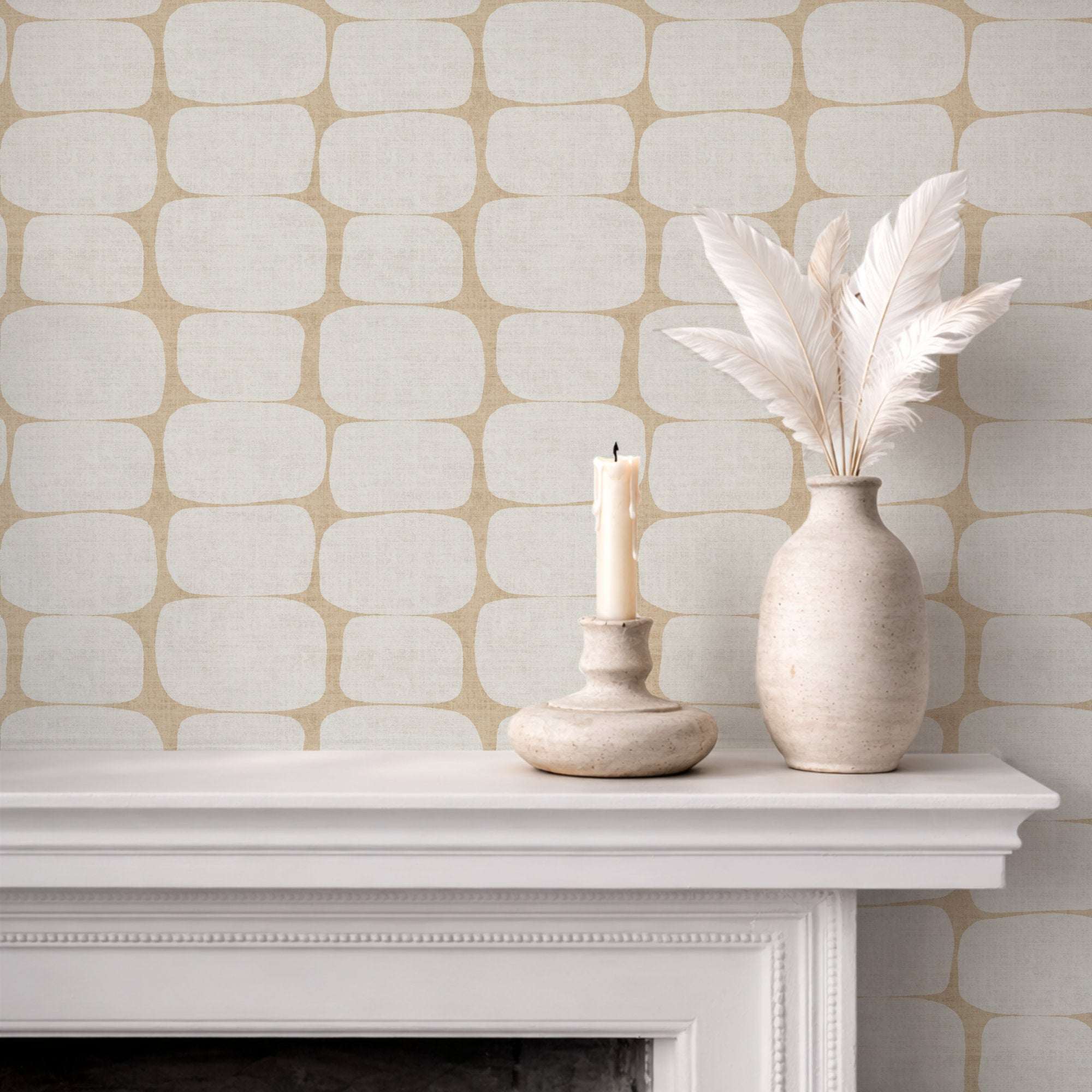 Wallpaper with tan-gold geometric pebble stripe pattern of rounded rectangles on light base.