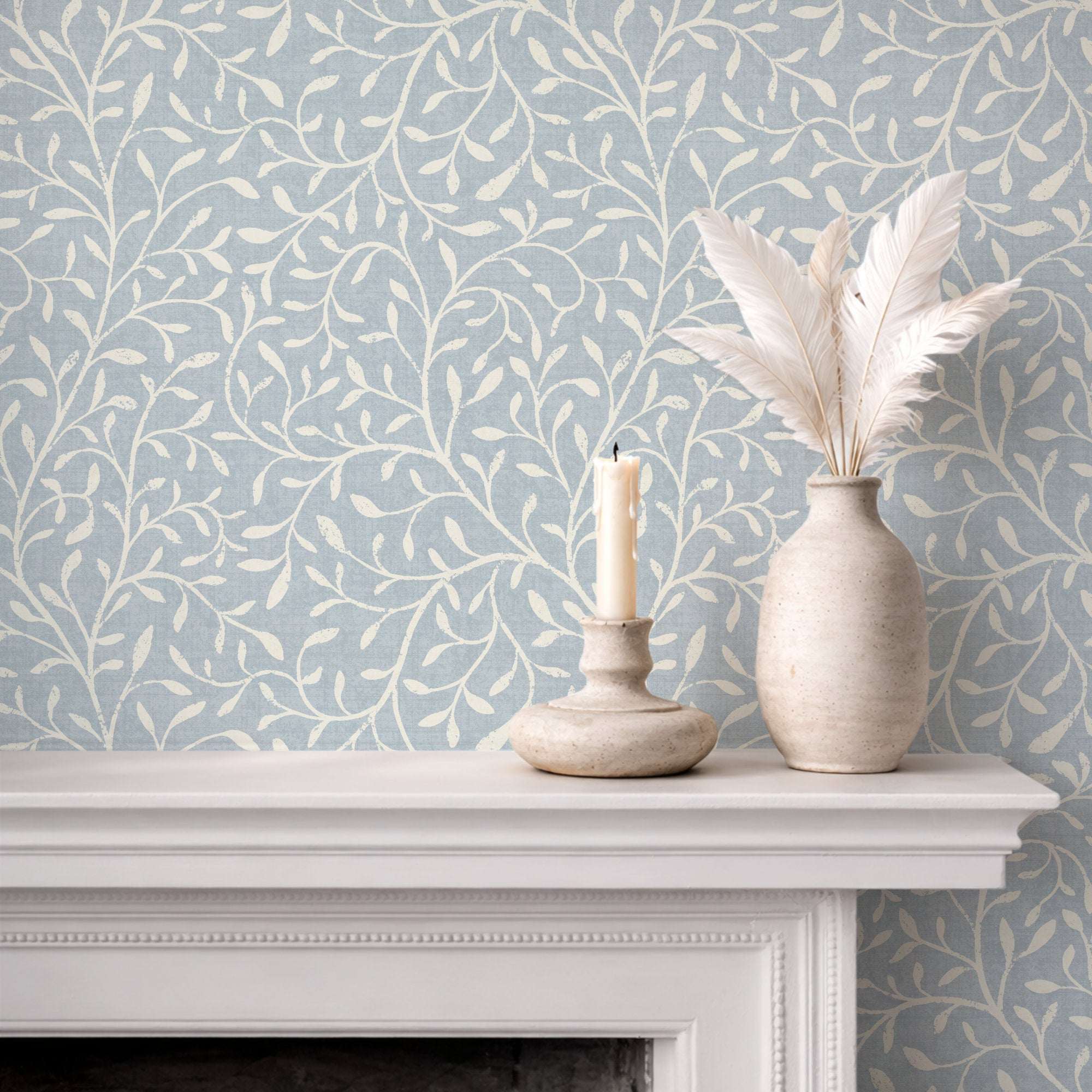 Botanical leaf silhouette wallpaper with white vine pattern on pale blue background