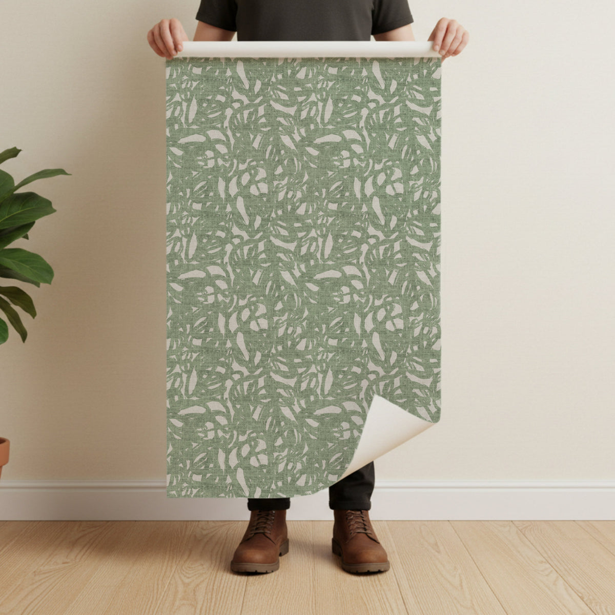 Brushstroke wallpaper roll in sage green showing abstract painterly pattern