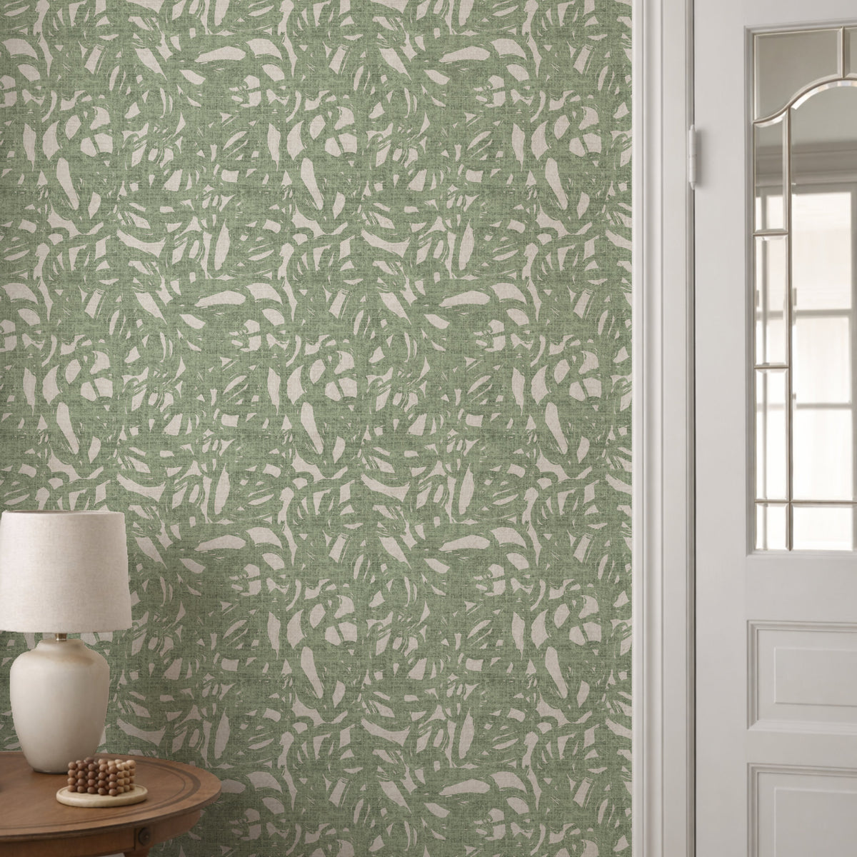 Abstract brushstroke wallpaper in sage green styled in a hallway setting