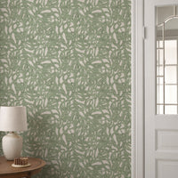 Abstract brushstroke wallpaper in sage green styled in a hallway setting