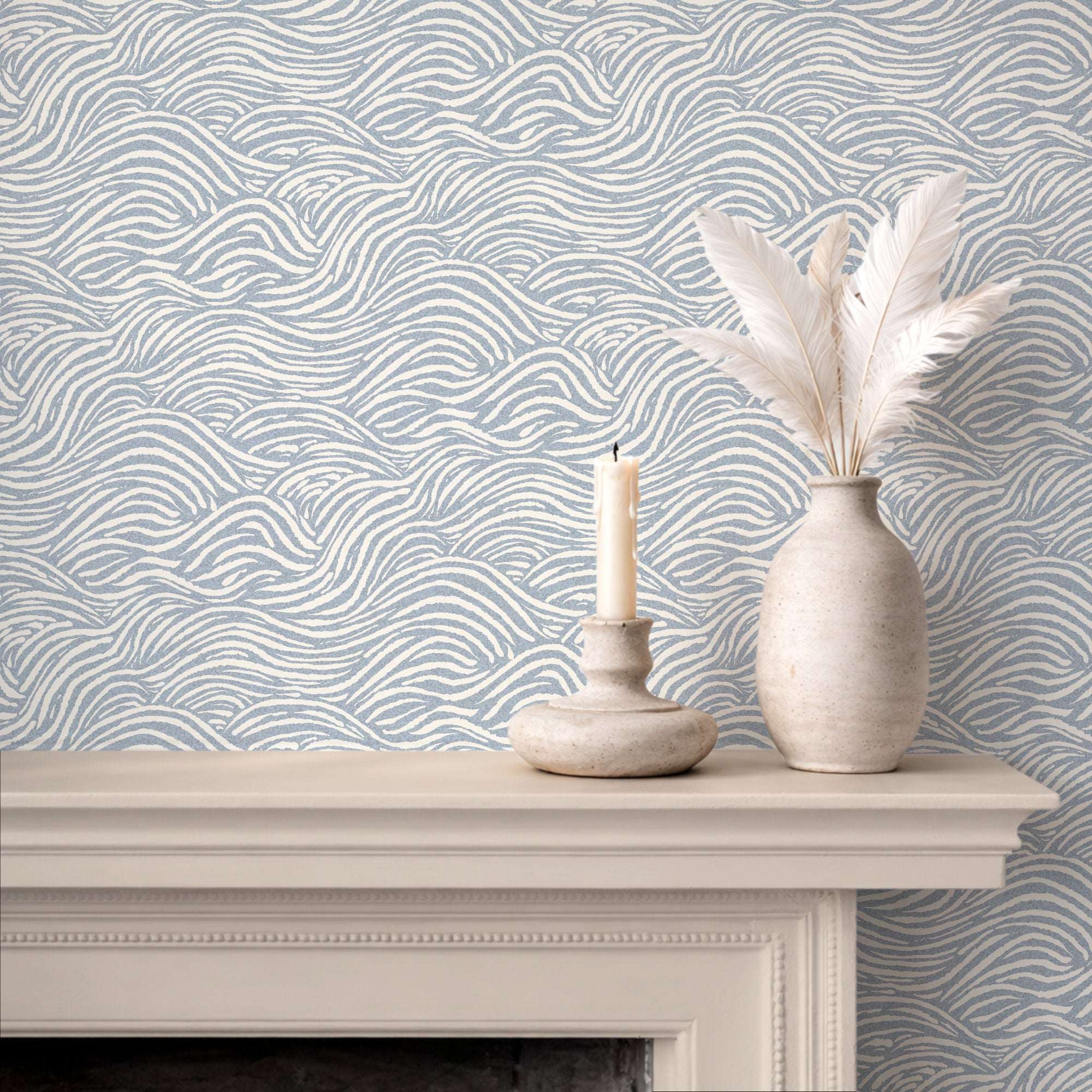 Wave-pattern wallpaper wall with light blue wavy lines behind a mantel shelf