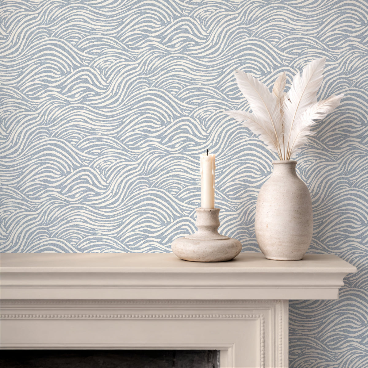 Coastal waves wallpaper in blue on fireplace wall with neutral coastal decor