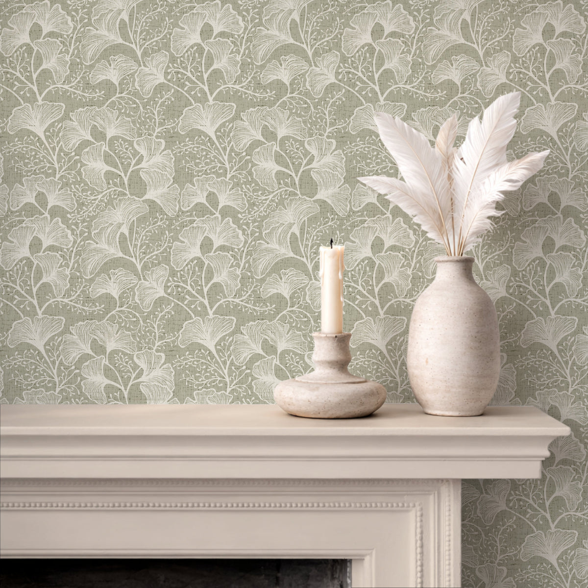 Ginkgo leaf wallpaper in sage green on fireplace wall with natural wood decor