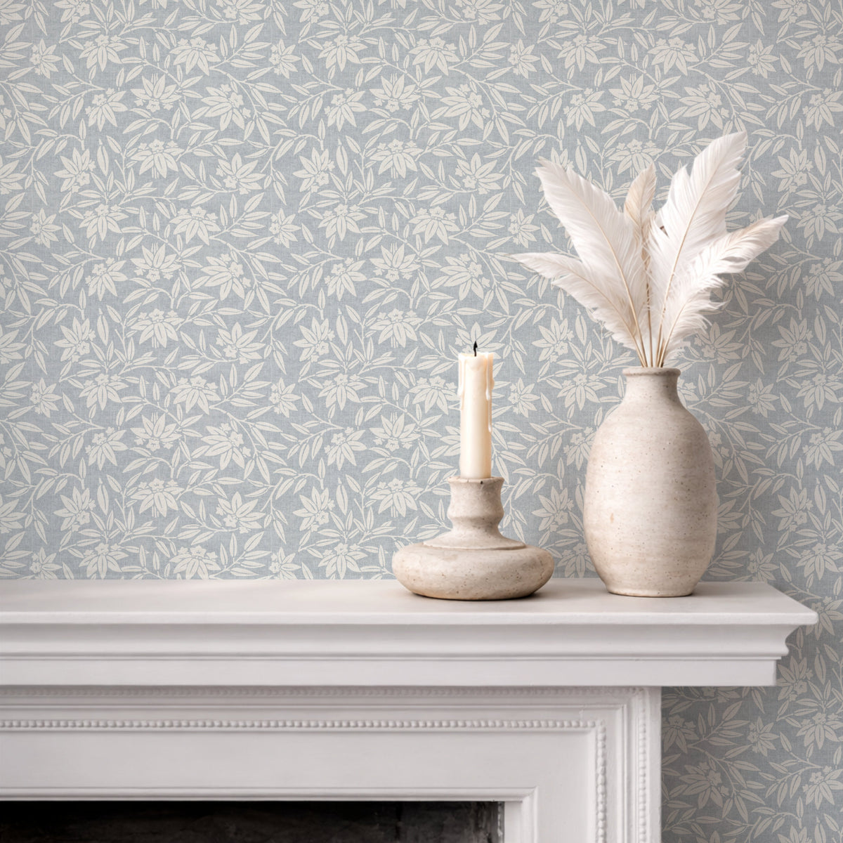Japandi botanical wallpaper in soft blue on fireplace wall with neutral decor