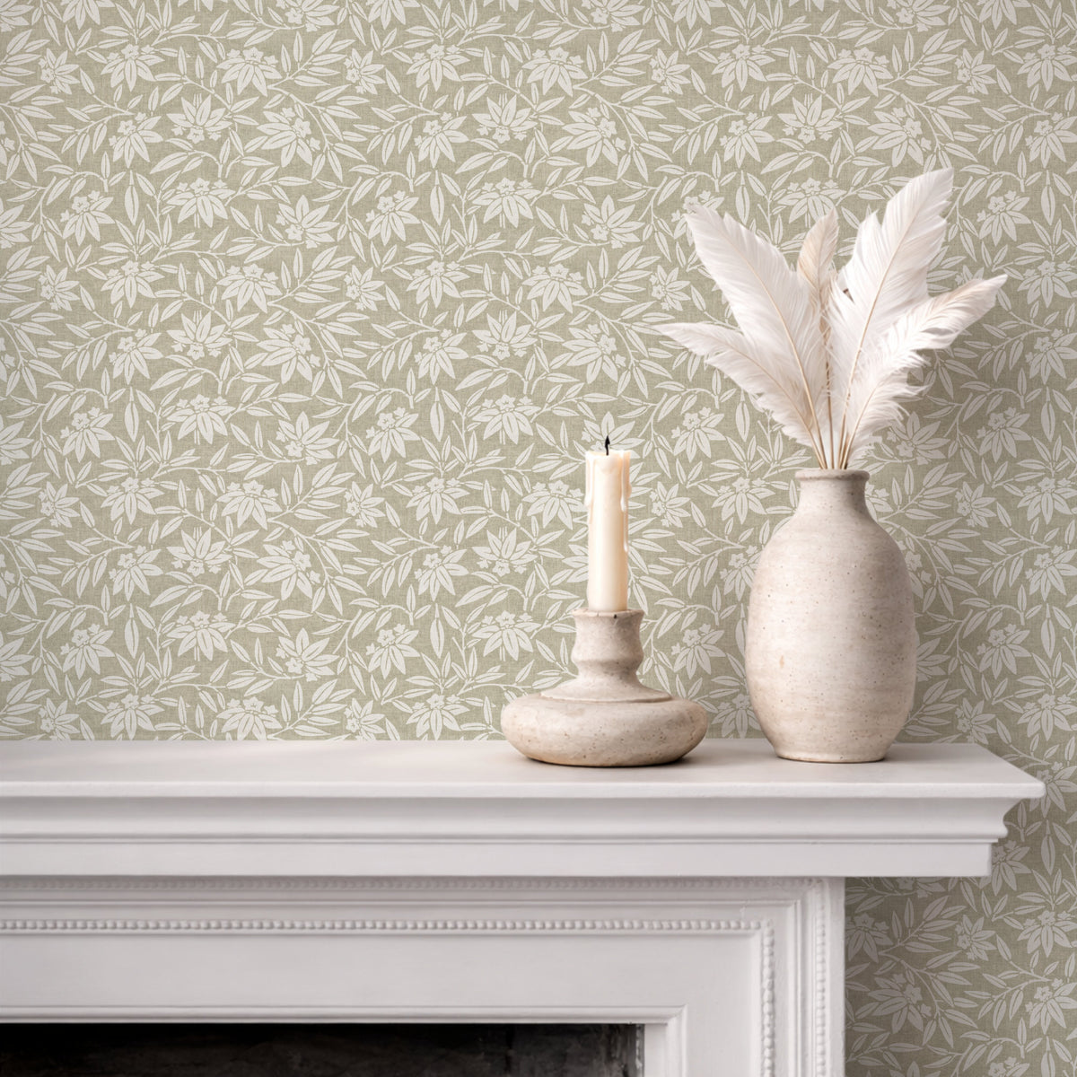 Japandi botanical wallpaper in sage green on fireplace wall with neutral decor