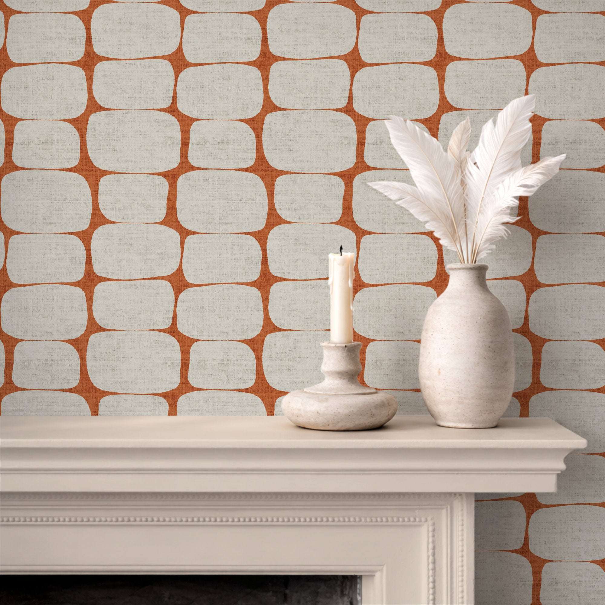Wallpaper with orange-and-white geometric pebble stripe pattern of rounded rectangles.