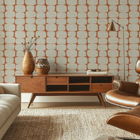 Retro geometric wallpaper in terracotta in mid-century modern living room with TV unit