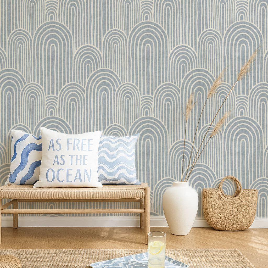 light blue Scandinavian arches wallpaper in a lhallway with a sofa and coastal decor