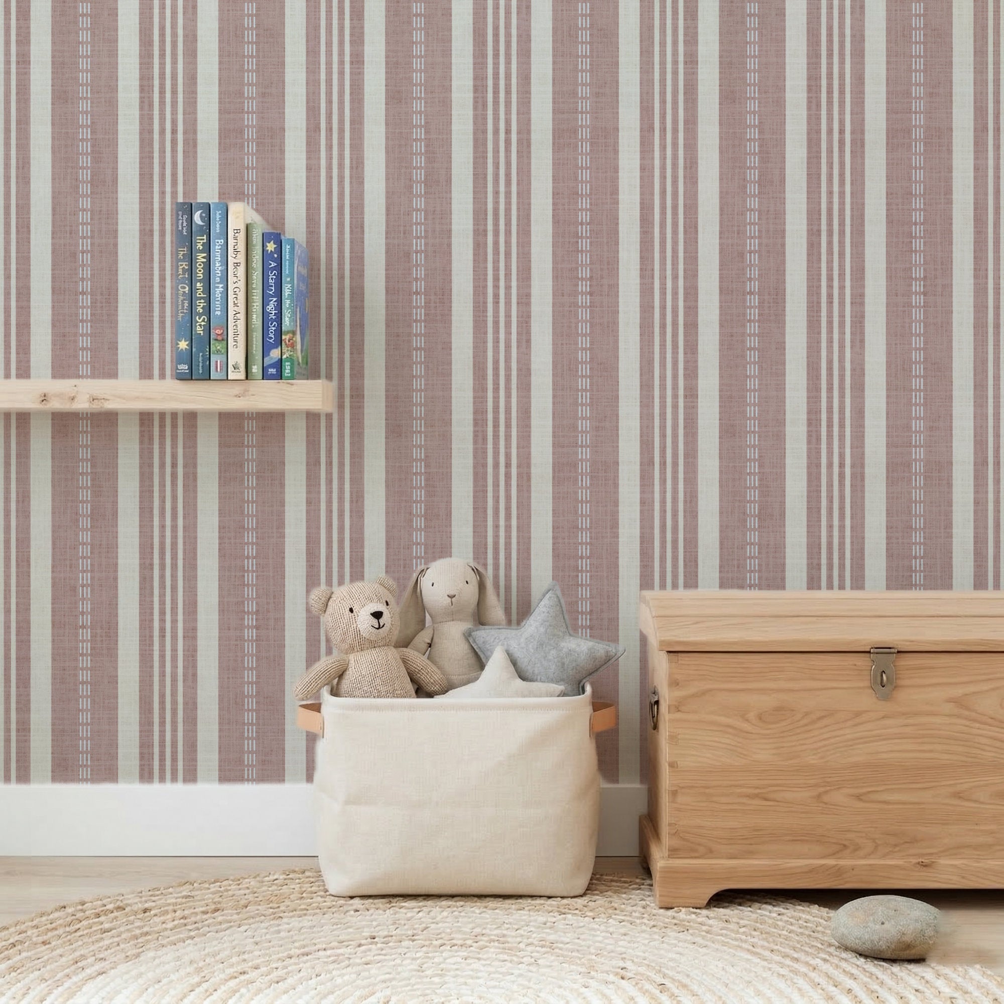 Pink Ticking stripe wallpaper with classic vertical stripes in soft colors, featuring toys and books in a cozy room setting.
