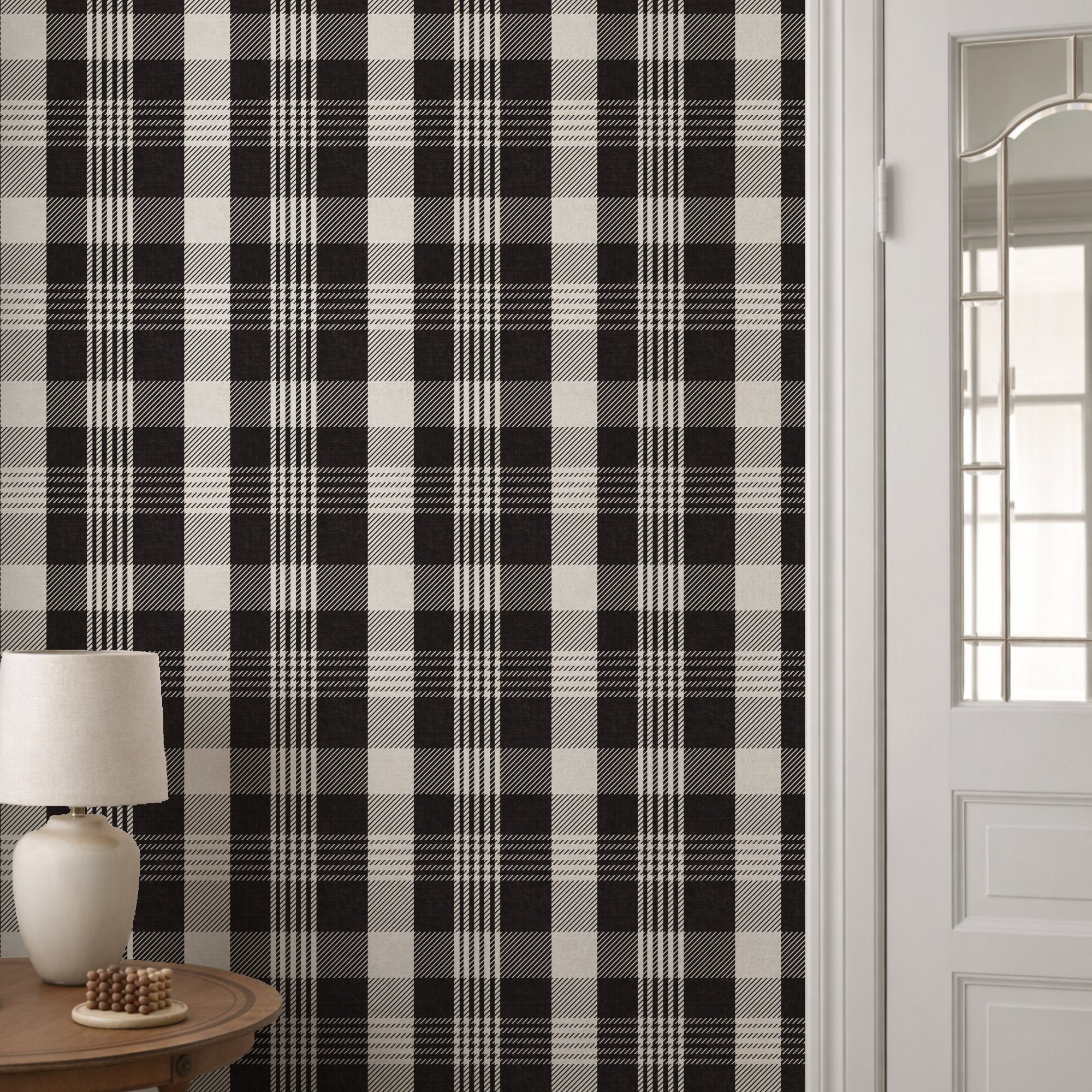 Black and white plaid wallpaper in room corner with lamp and natural light